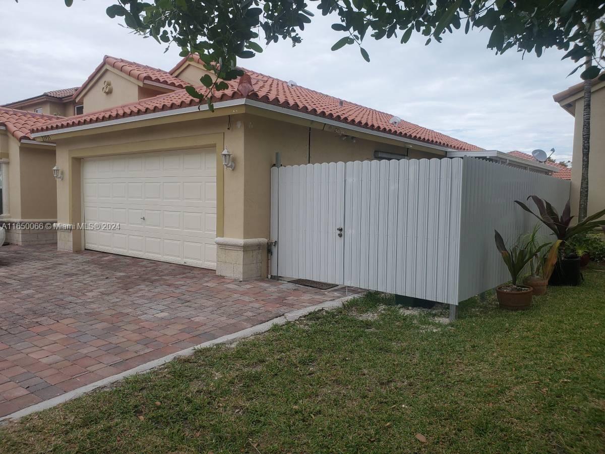 23935 Southwest 108th Place Homestead, FL 33032 - Photo 30 of 30 a view of a backyard with potted plants