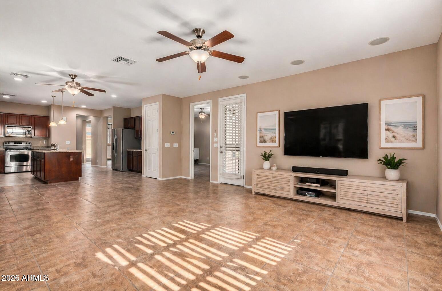 16093 West Almeria Road Goodyear, AZ 85395 - Photo 8 of 38 virtually staged family room