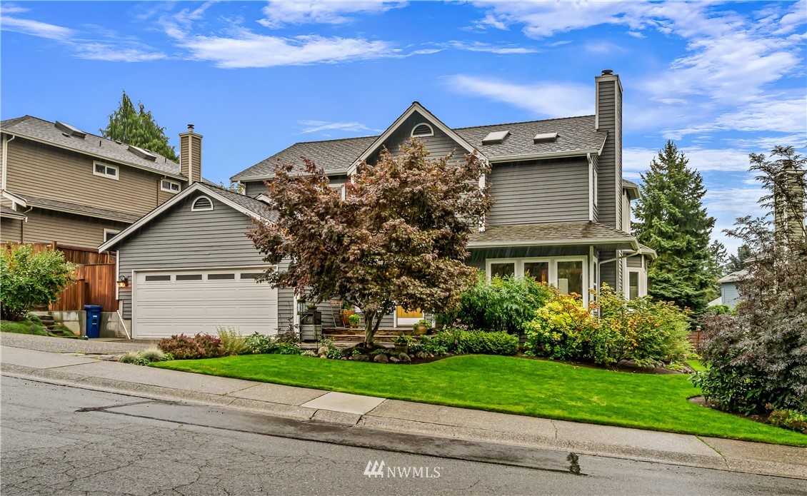 23701 3rd Place West Bothell, WA 98021 - Photo 2 of 31 front view of house with a yard and trees all around