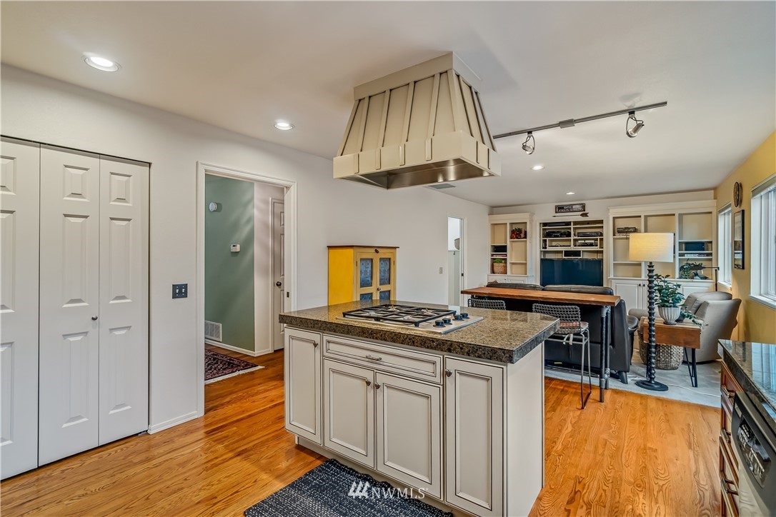 23701 3rd Place West Bothell, WA 98021 - Photo 13 of 31 a kitchen with stainless steel appliances granite countertop a stove and a view of living room