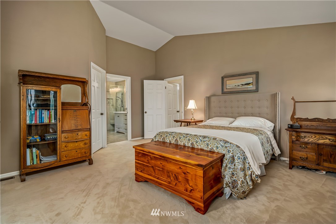 23701 3rd Place West Bothell, WA 98021 - Photo 18 of 31 a spacious bedroom with a bed and dresser