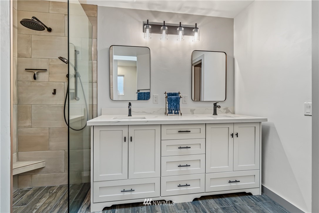 23701 3rd Place West Bothell, WA 98021 - Photo 20 of 31 a bathroom with a double vanity sink and a mirror