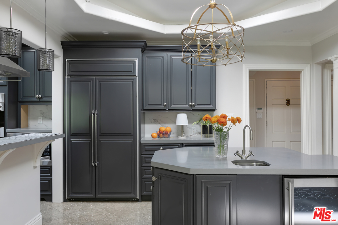 534 Lakeview Road Pasadena, CA 91105 - Photo 14 of 34 a kitchen with a refrigerator a sink and cabinets