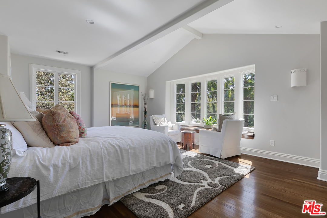 534 Lakeview Road Pasadena, CA 91105 - Photo 17 of 34 a bedroom with a bed and wooden floor