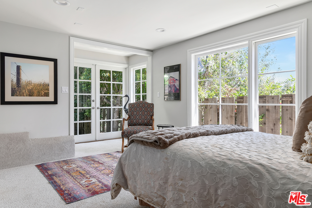 534 Lakeview Road Pasadena, CA 91105 - Photo 25 of 34 a bedroom with a bed and glass window