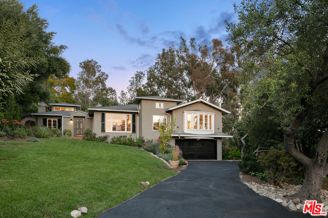 534 Lakeview Road Pasadena, CA 91105 - Photo 26 of 34 a front view of a house with a garden and yard