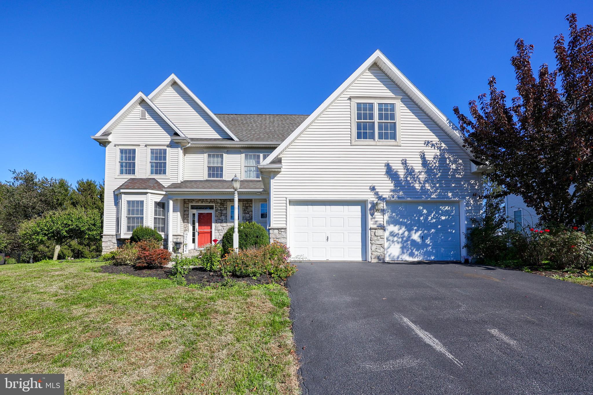 327 Squire Lane Lititz, PA 17543 - Photo 1 of 48 a front view of house with yard and trees in the background
