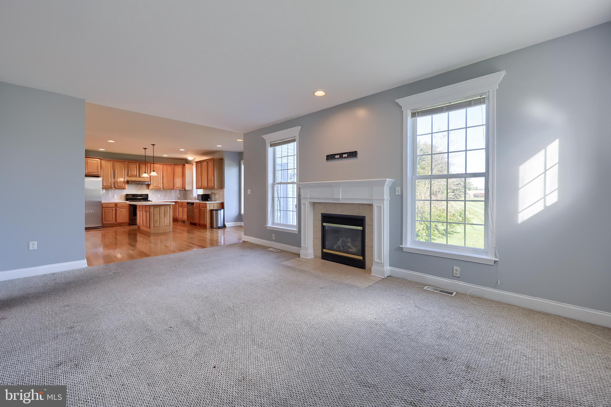 327 Squire Lane Lititz, PA 17543 - Photo 15 of 48 a view of a livingroom with a fireplace and window