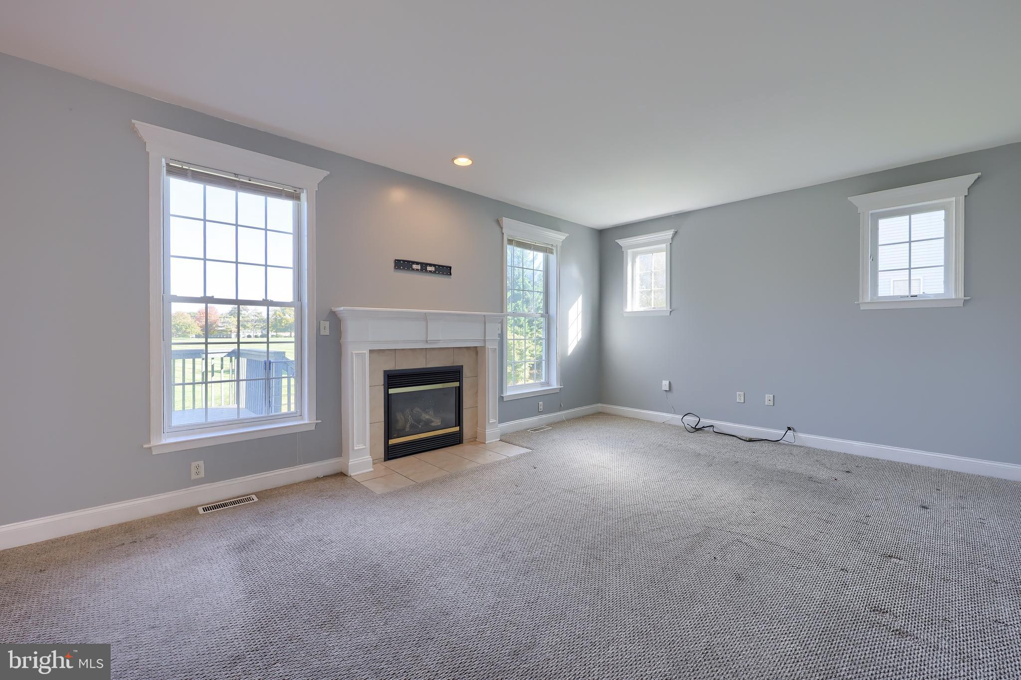 327 Squire Lane Lititz, PA 17543 - Photo 18 of 48 an empty room with a fireplace