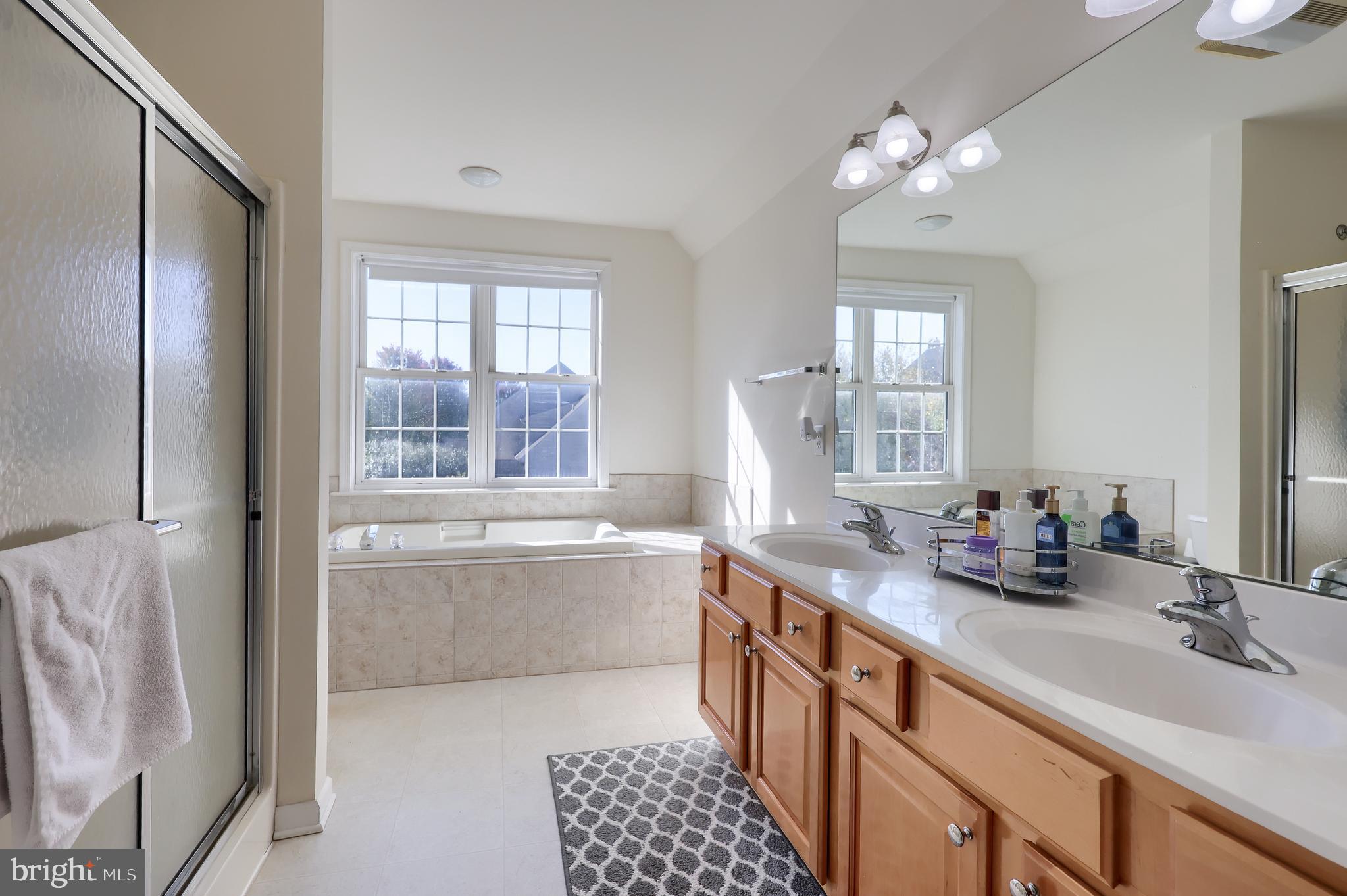 327 Squire Lane Lititz, PA 17543 - Photo 23 of 48 a bathroom with a tub sink and mirror