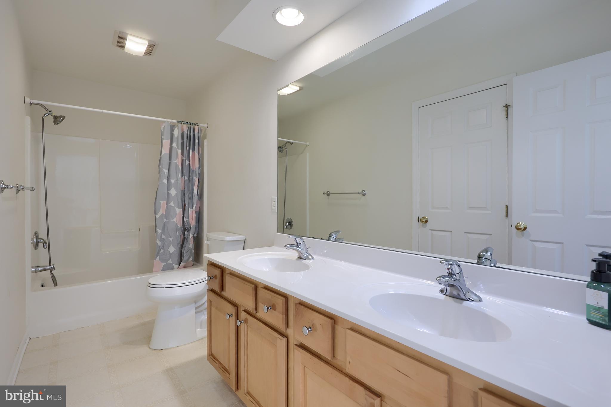 327 Squire Lane Lititz, PA 17543 - Photo 27 of 48 a bathroom with a double vanity sink toilet and a mirror