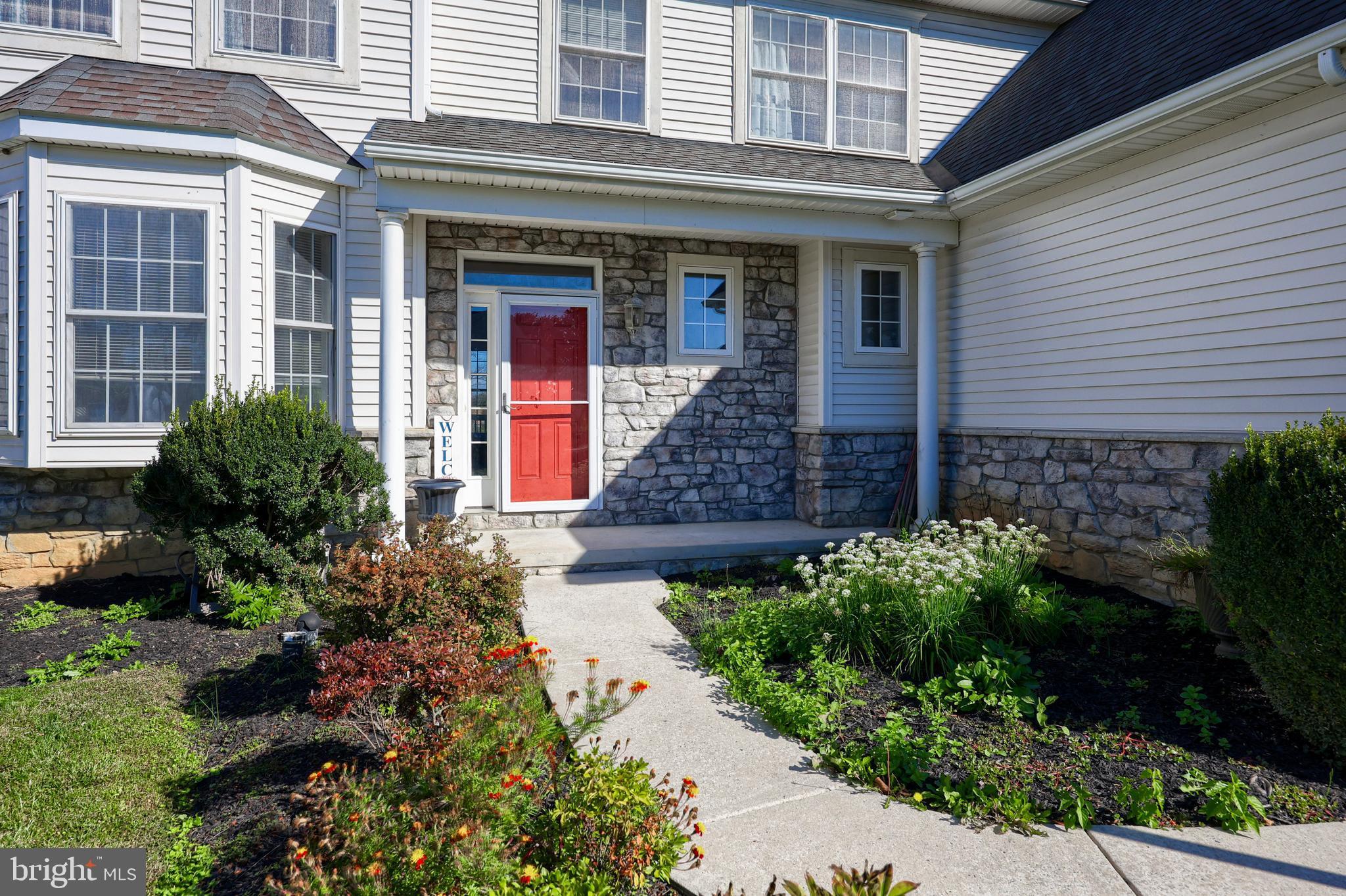 327 Squire Lane Lititz, PA 17543 - Photo 47 of 48 a front view of a house with garden