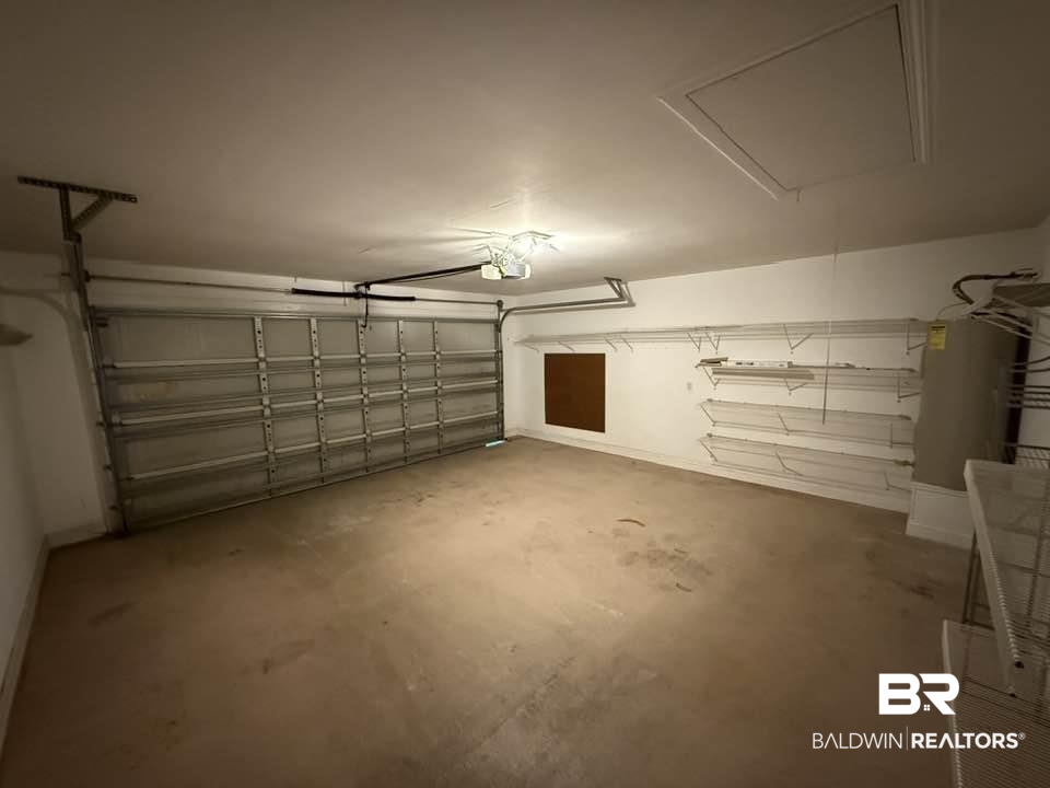 10428 South Side Loop Fairhope, AL 36532 - Photo 5 of 28 Garage featuring a garage door opener