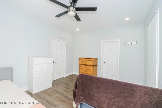 a bedroom with a bed and a closet