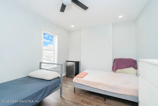 a bedroom with a bed and a table in it