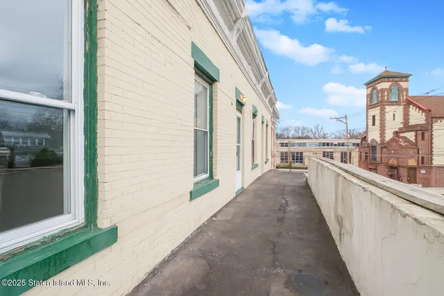 a view of a balcony with city view