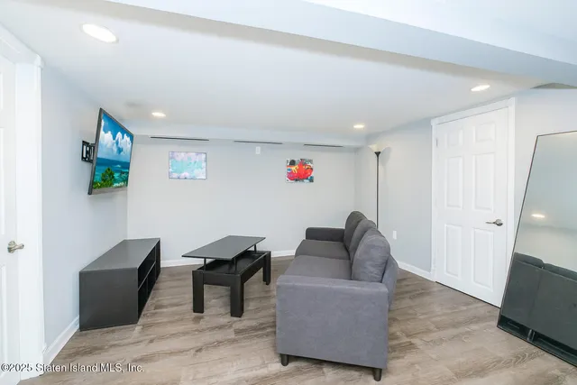 a living room with furniture and a rug
