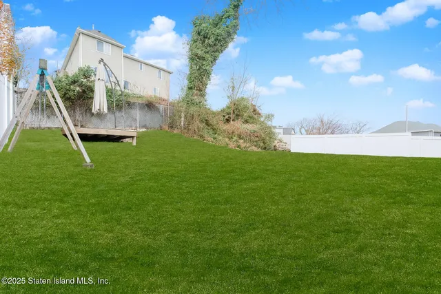 a backyard of a house with lots of green space