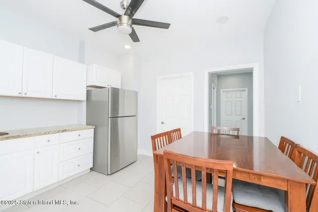 a kitchen with stainless steel appliances granite countertop a refrigerator a stove a sink and dishwasher