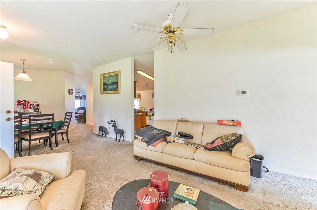 36027 Allen Road South Roy, WA 98580 - Photo 28 of 33 a living room with furniture and a chandelier