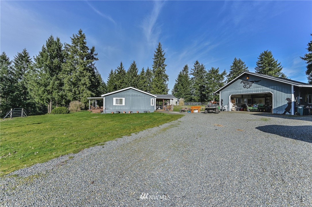 36027 Allen Road South Roy, WA 98580 - Photo 8 of 33 a front view of a house with a yard and garage