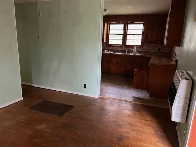 a kitchen with stainless steel appliances granite countertop a sink and a cabinets