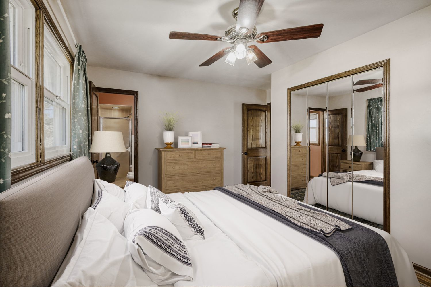 340 West Middle Street South Elgin, IL 60177 - Photo 12 of 28 a bedroom with a large bed and a chandelier
