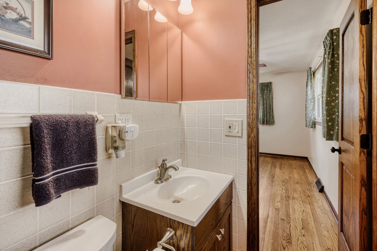 340 West Middle Street South Elgin, IL 60177 - Photo 14 of 28 a bathroom with a sink and mirror