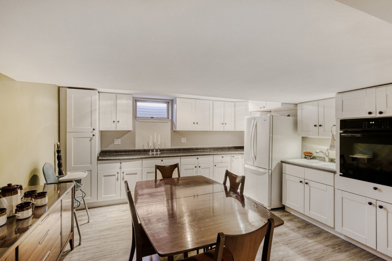 340 West Middle Street South Elgin, IL 60177 - Photo 20 of 28 a kitchen with stainless steel appliances granite countertop a stove a refrigerator a sink a dining table and chairs with wooden floor