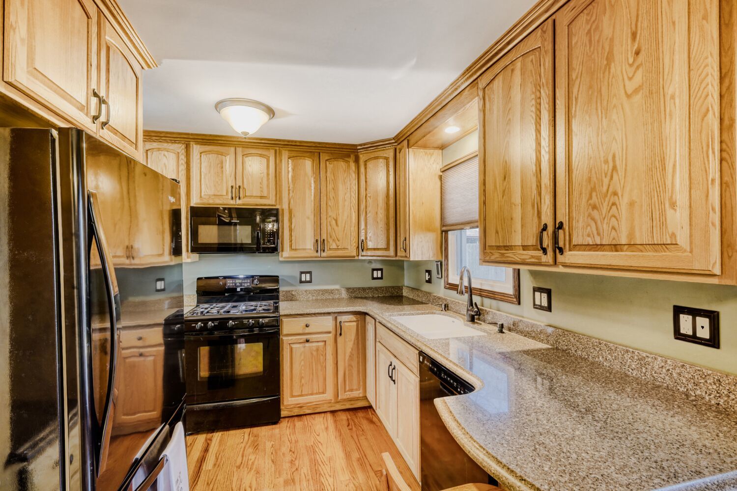 340 West Middle Street South Elgin, IL 60177 - Photo 6 of 28 a kitchen with stainless steel appliances granite countertop a sink a stove and a refrigerator