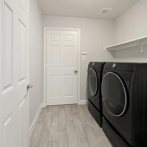 a utility room with dryer and washer