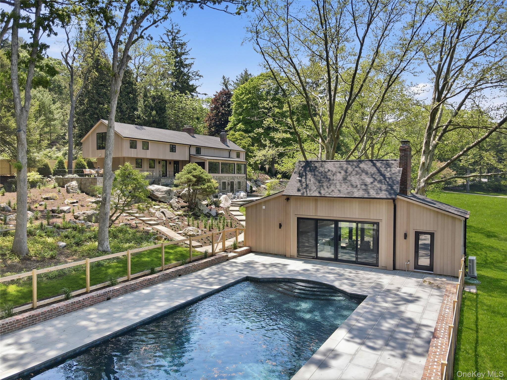 39 Old Snake Hill Road Pound Ridge, NY 10576 - Photo 3 of 37 a front view of a house with garden