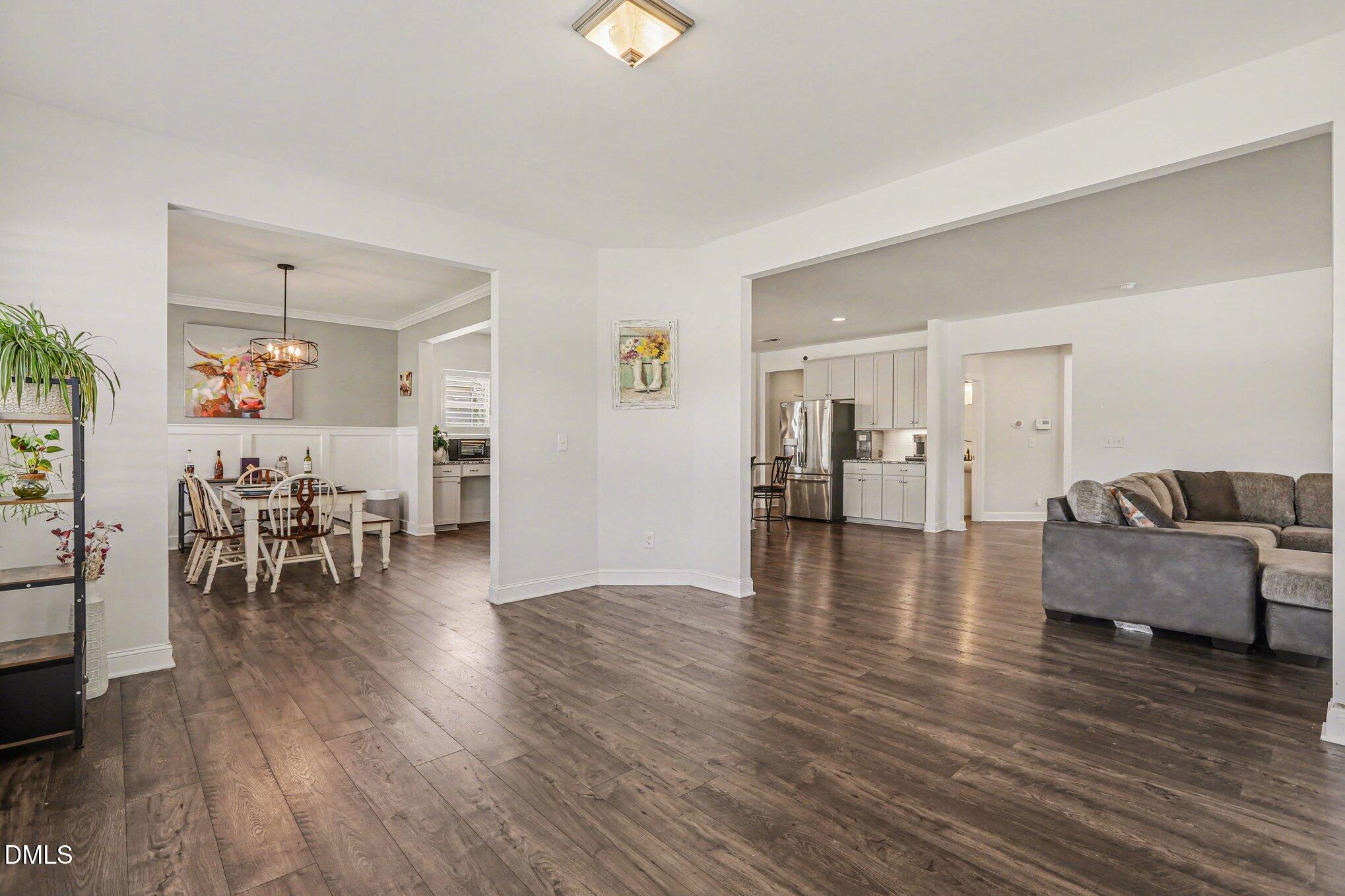 432 Seabring Lane Raleigh, NC 27603 - Photo 7 of 29 a living room with furniture and wooden floor