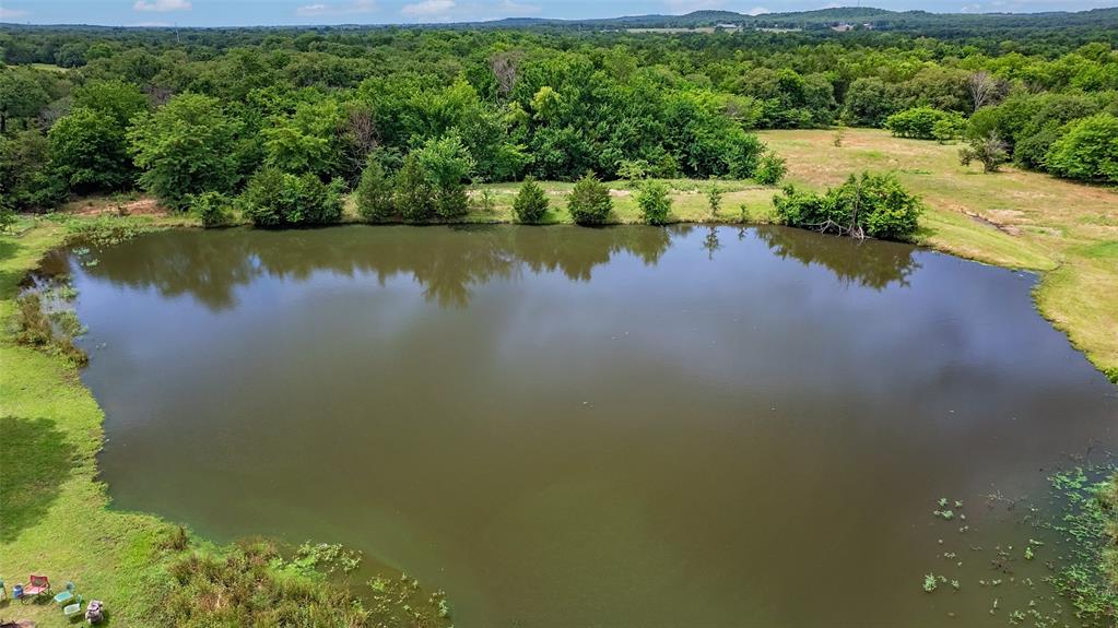 178 County Road 178 Gainesville, TX 76240 - Photo 2 of 7 a view of a lake with a yard and mountain view