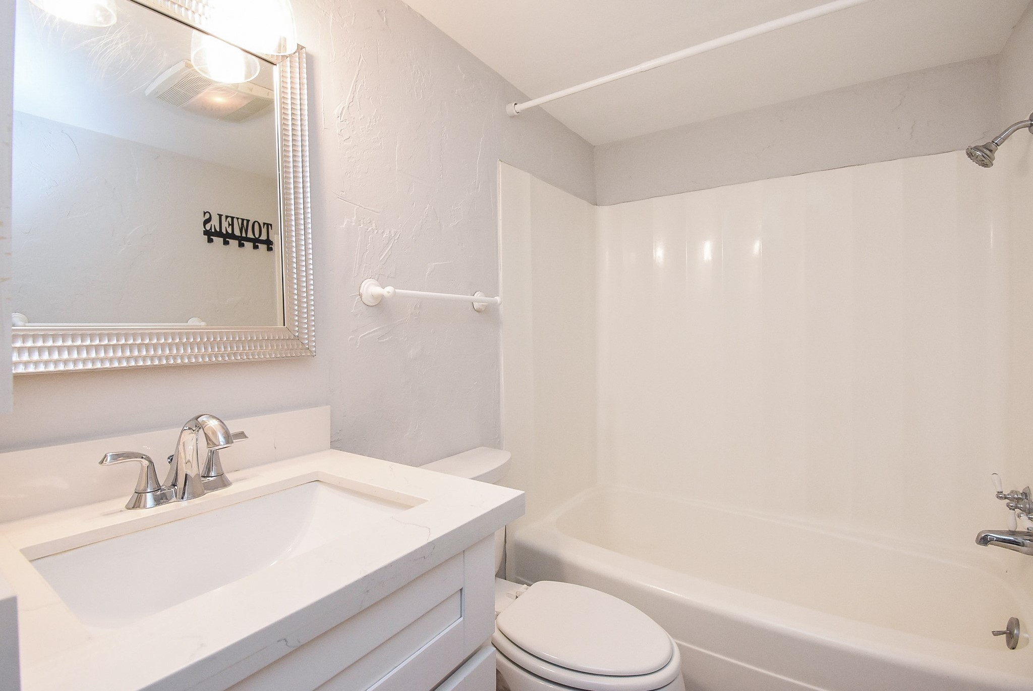 201 Vanderpool Lane, Unit 113 Houston, TX 77024 - Photo 35 of 45 a bathroom with a sink toilet and shower