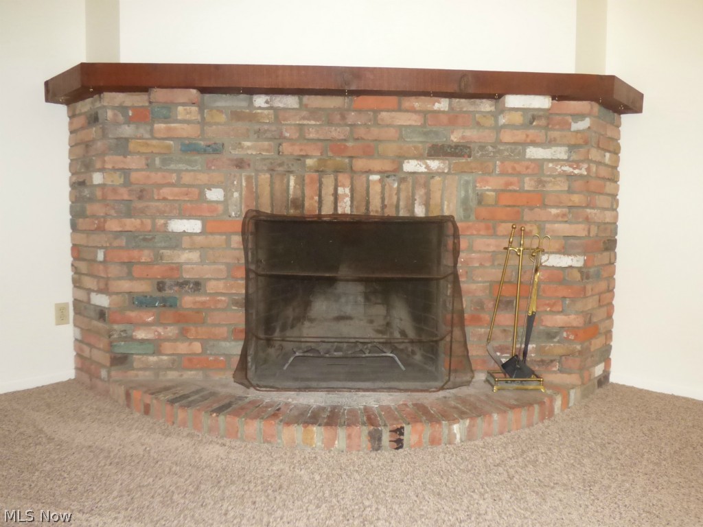 1265 Bell Road Chagrin Falls, OH 44022 - Photo 8 of 24 Brick wood burning fireplace with wood mantle.