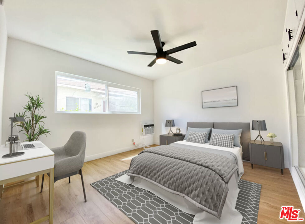 3824 Keystone Avenue, Unit 2 Culver City, CA 90232 - Photo 5 of 10 a bedroom with a bed and a chair