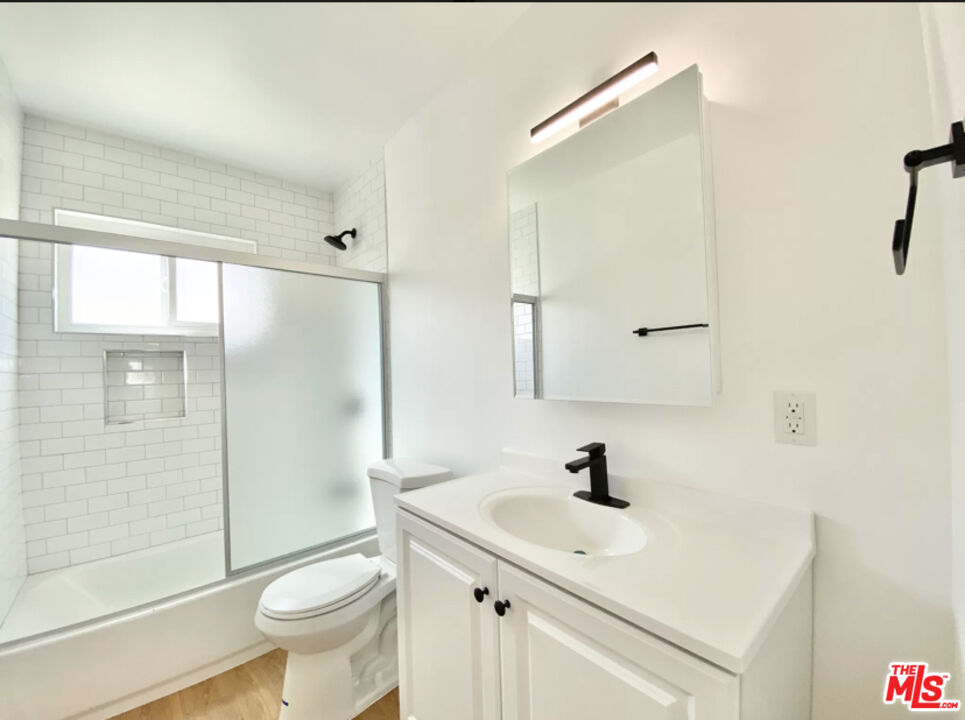 3824 Keystone Avenue, Unit 2 Culver City, CA 90232 - Photo 7 of 10 a bathroom with a sink toilet a mirror and shower