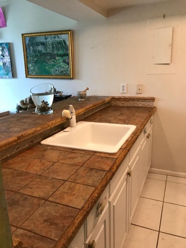 799 Jeffery Street, Unit 308 Boca Raton, FL 33487 - Photo 6 of 9 a bathroom with a sink and a mirror