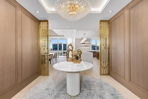 a kitchen with a refrigerator and a sink