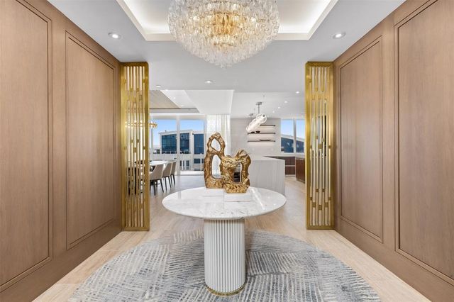 a kitchen with a refrigerator and a sink