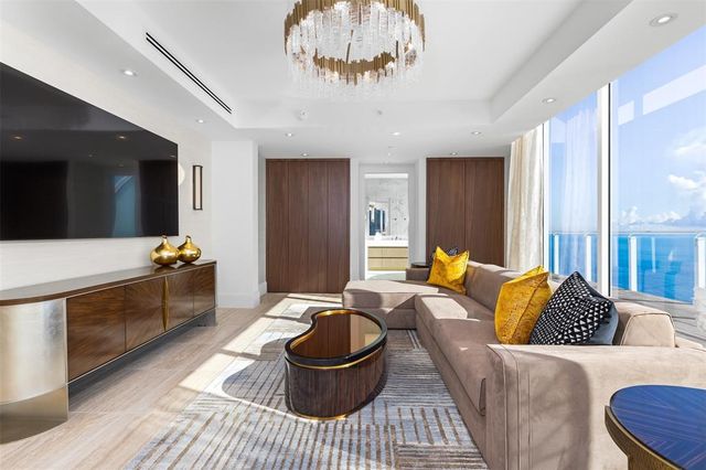 a bathroom with a granite countertop sink a mirror and shower