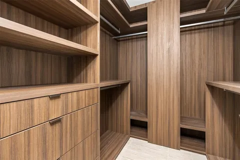 a bedroom with a bed and a lamp