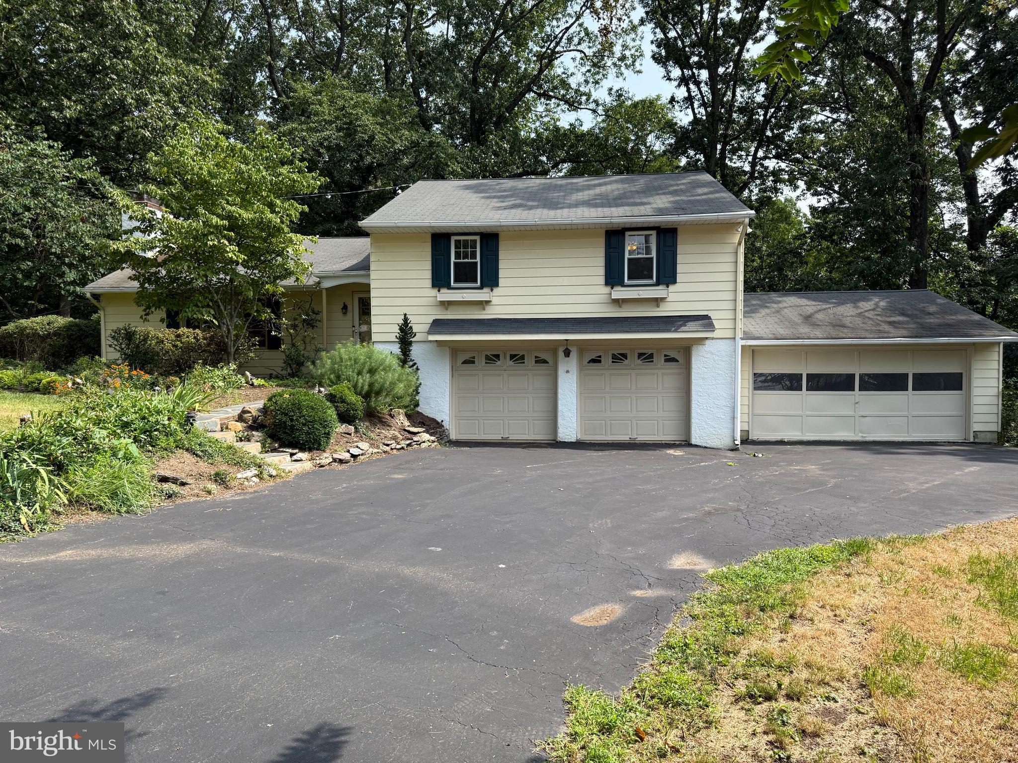 325 Greene Road Berwyn, PA 19312 - Photo 3 of 50 a front view of a house with a yard and garage