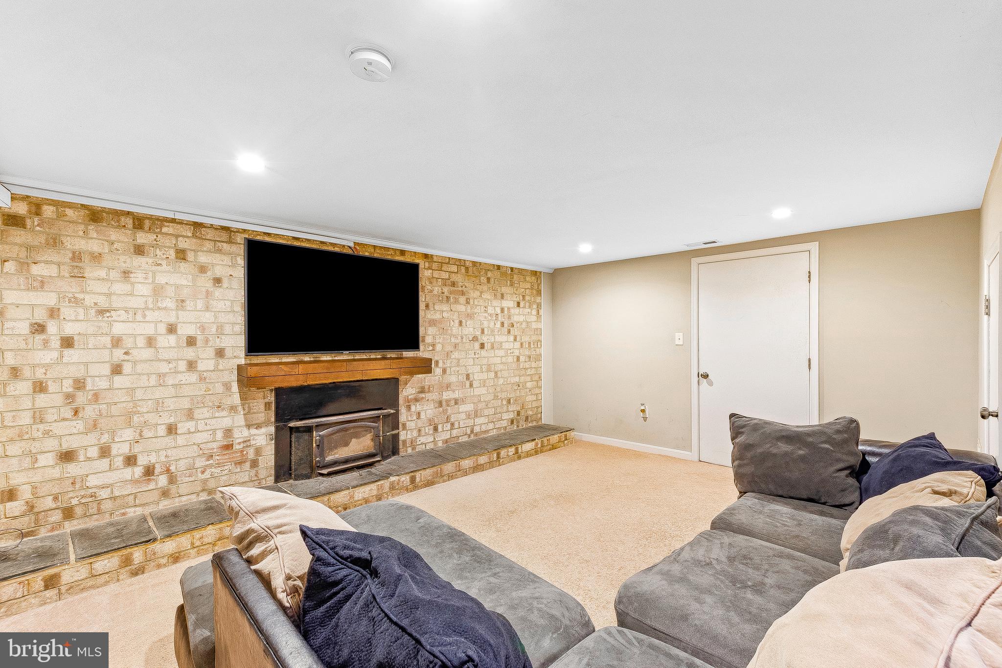 2663 Solomons Island Road Edgewater, MD 21037 - Photo 33 of 36 Basement Family Room with all Brick Fireplace