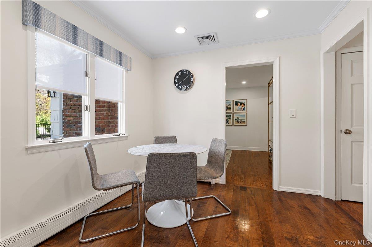 8 Heritage Court Cold Spring Harbor, NY 11724 - Photo 15 of 38 a view of a dining room with furniture window and wooden floor