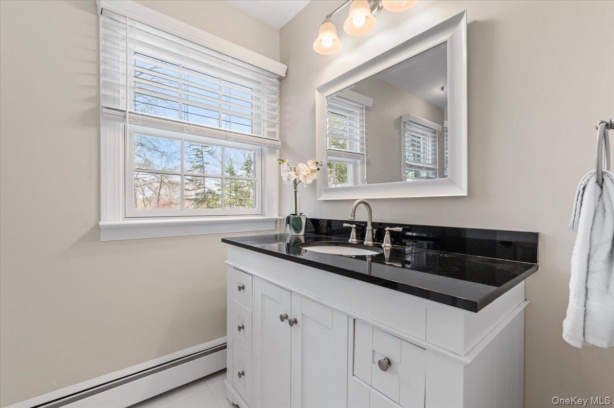 8 Heritage Court Cold Spring Harbor, NY 11724 - Photo 23 of 38 a sink and a mirror