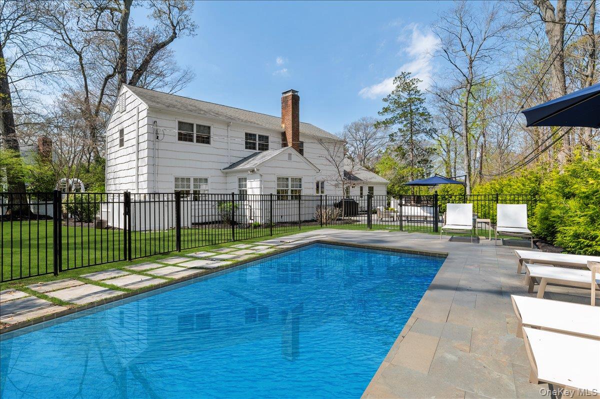 8 Heritage Court Cold Spring Harbor, NY 11724 - Photo 30 of 38 a view of a house with swimming pool