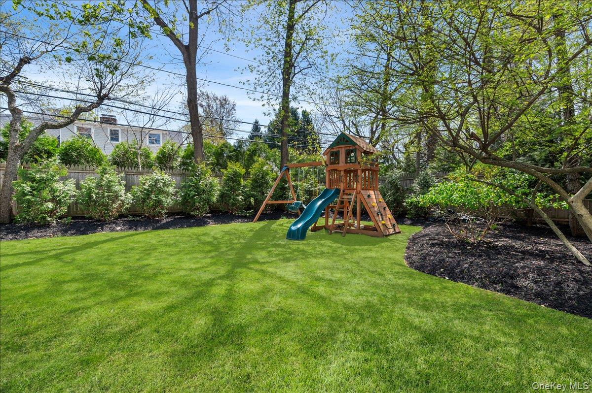 8 Heritage Court Cold Spring Harbor, NY 11724 - Photo 35 of 38 a view of a garden with a slide