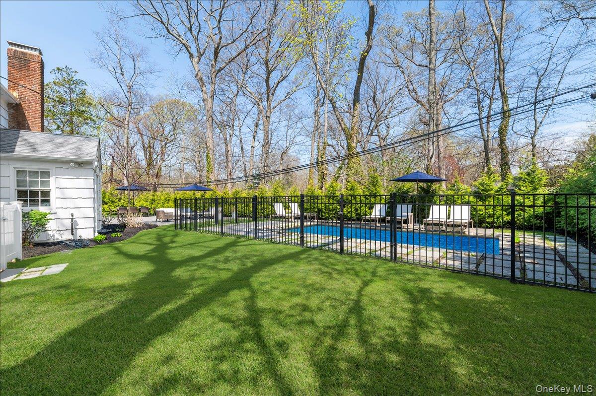 8 Heritage Court Cold Spring Harbor, NY 11724 - Photo 37 of 38 a view of yard with a house in the background